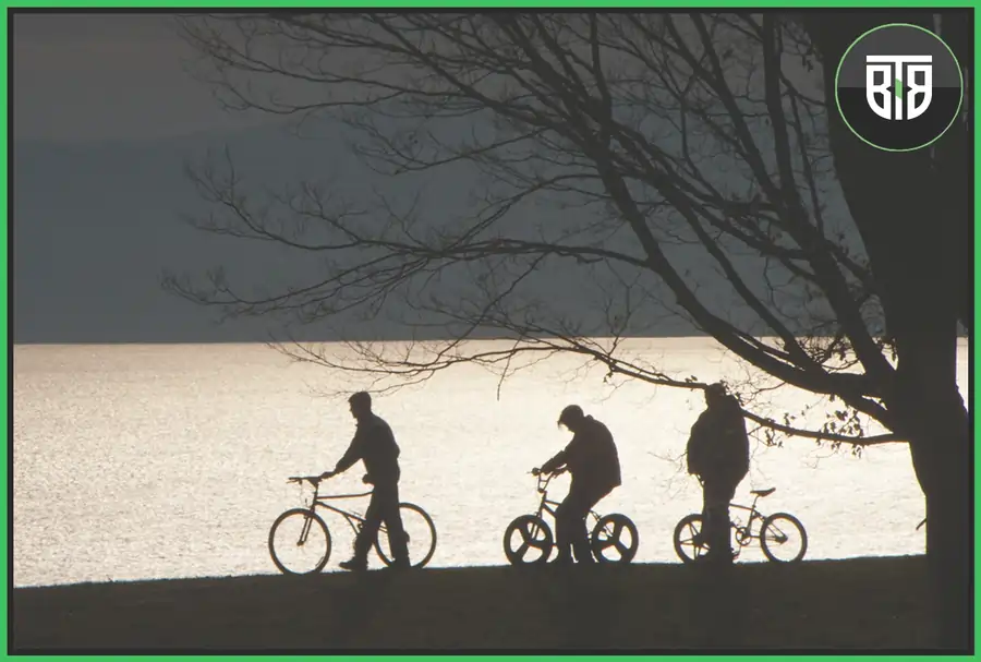 three friends are cycling near a lake in night in Super Dark Times 2017, good suspenseful movies on hulu