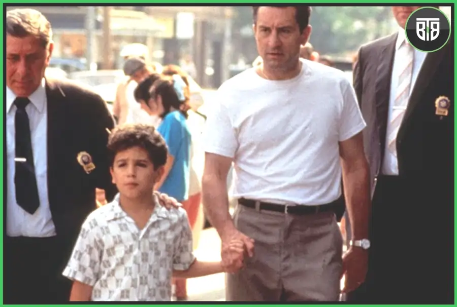 a man is holding a kid hand in the market in A Bronx Tale - A 1993 Crime/Drama Movie, movies with deep meaning about life