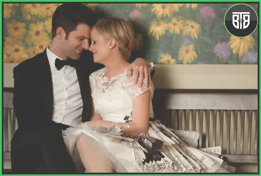 a couple is doing romance on a sofa in Parks and recreation sitcom, blue bloods imdb