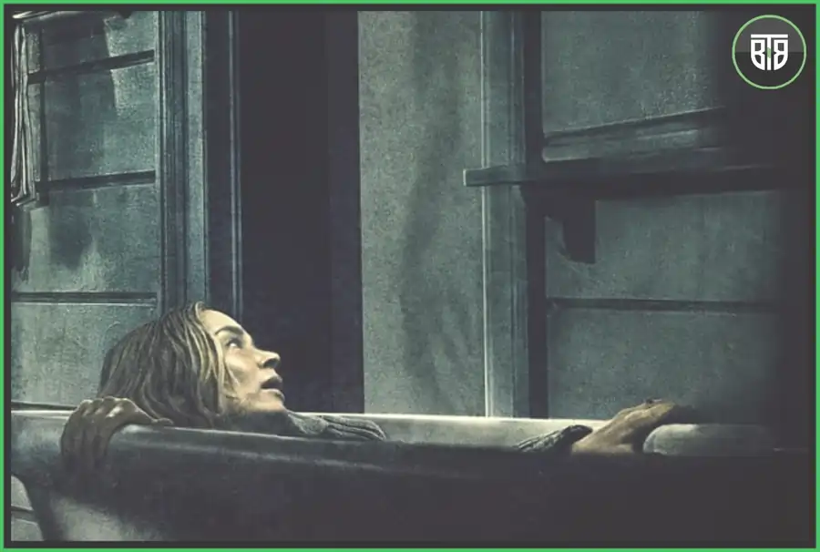 a lady is scared and is hiding in the bath in A Quiet Place 2018, best horror movies of all time