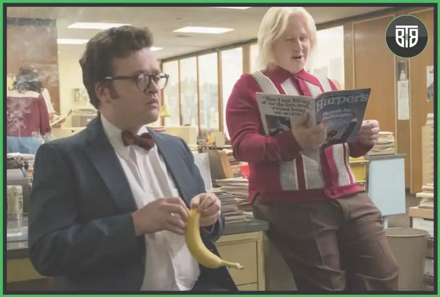 A man is holding a banana and another one holding a newspaper in a Movies A Futile and stupid gesture, best comedy movies on netflix