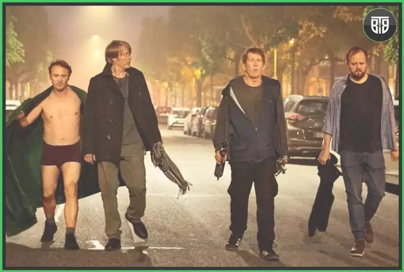 four men are walking on a road after a party in a movie Another Round, good funny movies on hulu