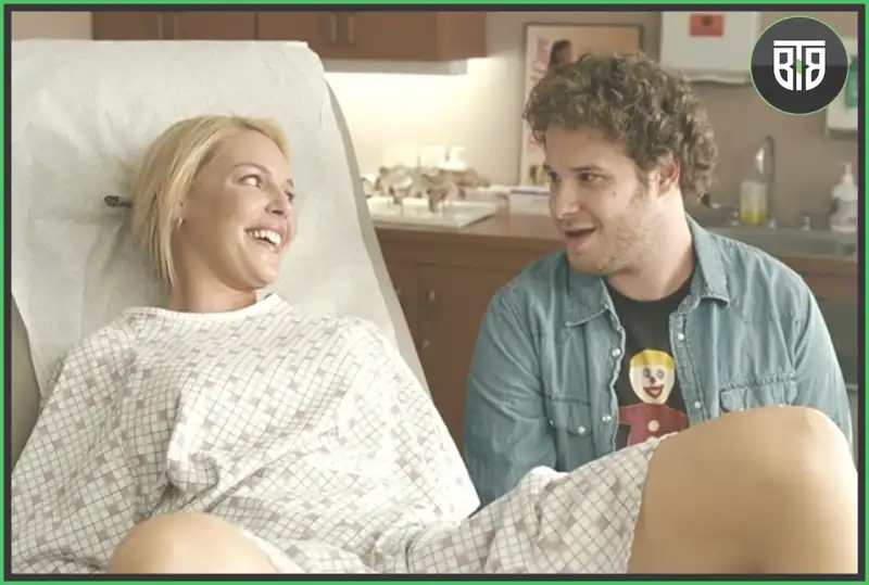 a lady is giving birth to a child and laughing with a man that is sitting besides her in a Movie Knocked Up, best funny movies on hulu