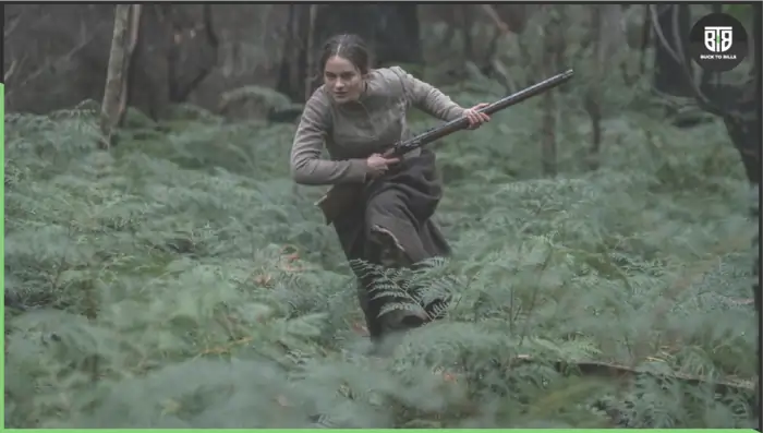 a girl is running holding a gun in a movie the nightingale newest horror movies on hulu