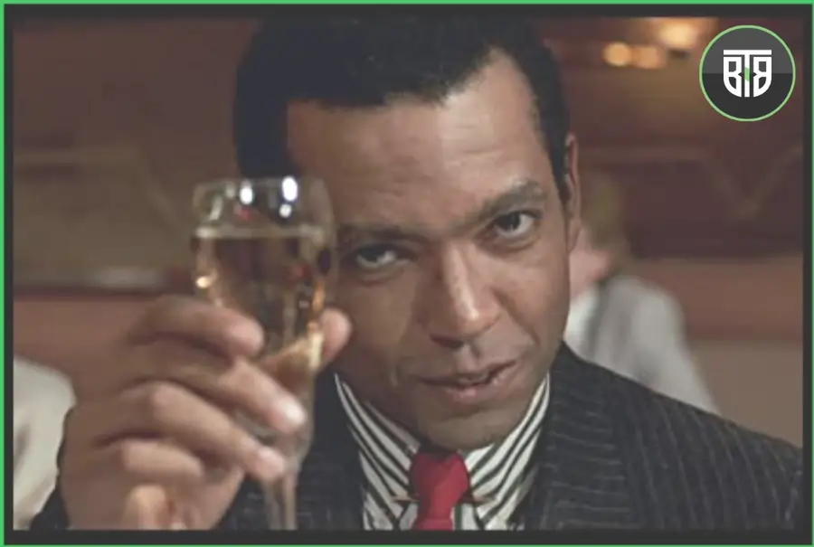 a man is cheering his glass in Chameleon Street 1989, criterion collection streaming