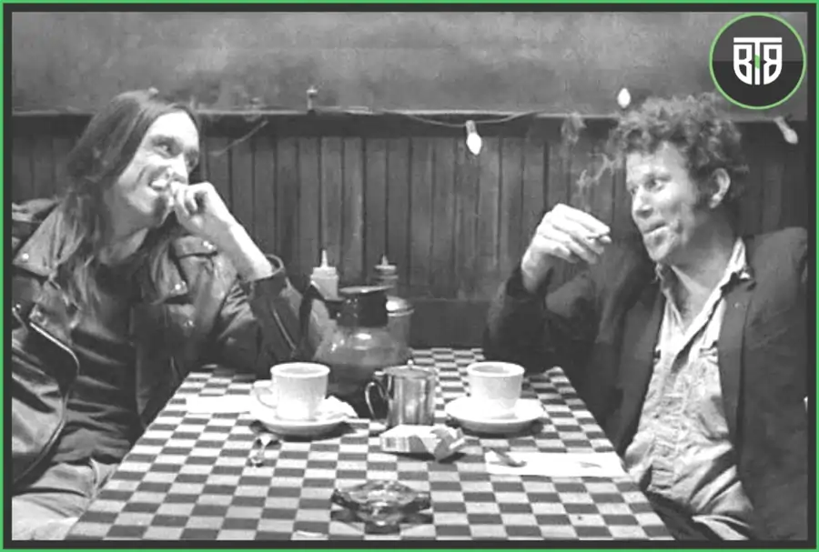 two men are taking coffee in Coffee and Cigaretters2003, criterion streaming