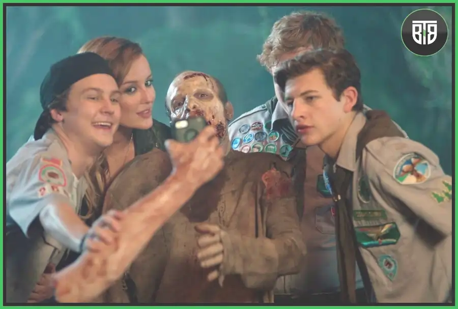 a scout is taking selfie with a zombie in a movie Scouts Guide to the Zombie Apocalypse, horror and comedy movies