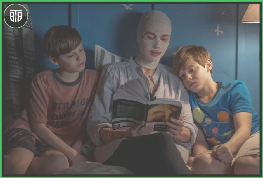 a movie scene of Goodnight Mommy two children are laying besides Naomi Watts