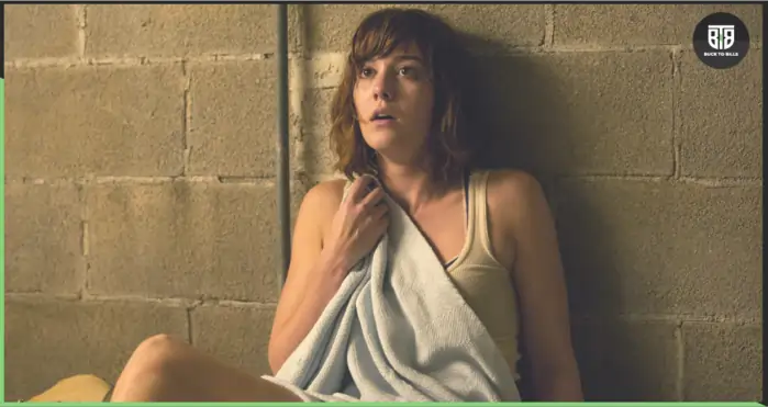 A girl is scared from something in a movie 10 cloverfield lane