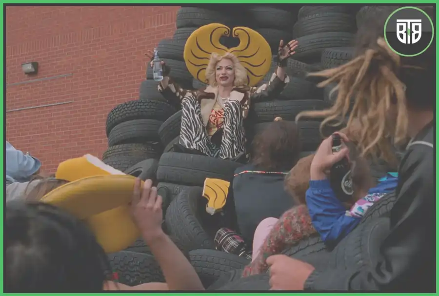 few people are looking at a lady who is laying on tires in Hedwig and the Angry Inch 2001, godzilla criterion 