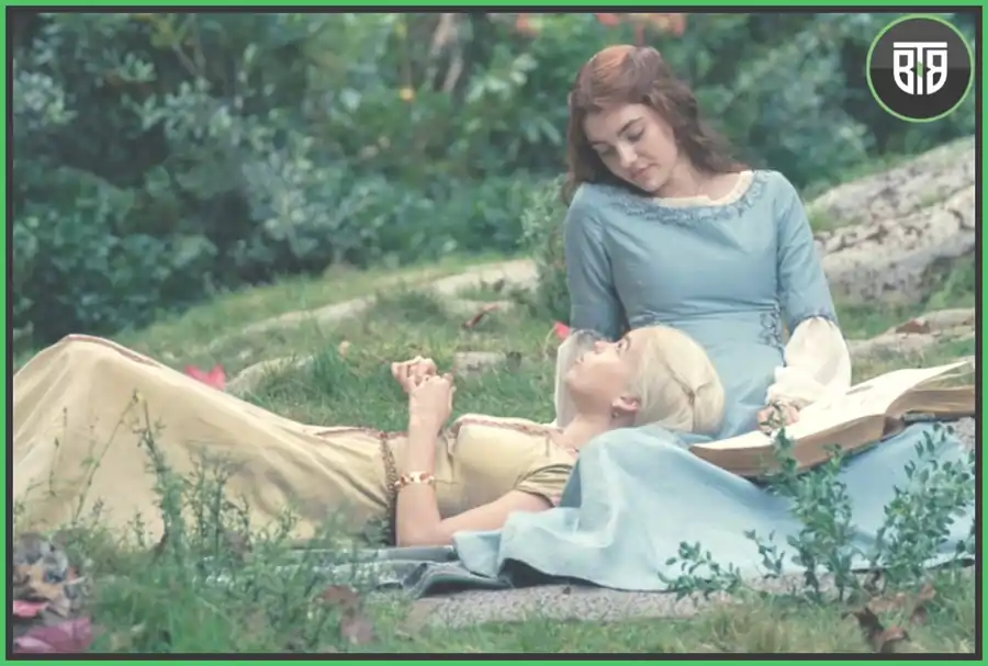 one girl is laying in the other lady legs in a garden in House of Dragon, house of the dragon cast