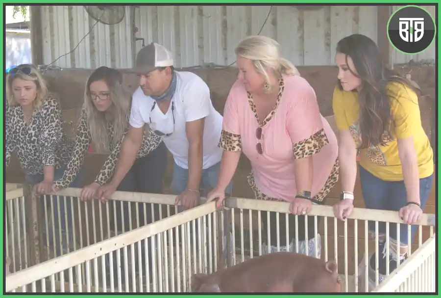 4 ladies and one man is standing near pig farm in Pig Royalty, discoveryplus shows