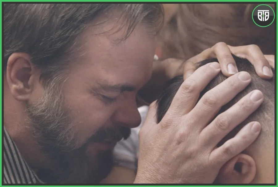 a man is praying while touching another man head in Pray Away - A 2021 Documentary, best neflix documentary on nea