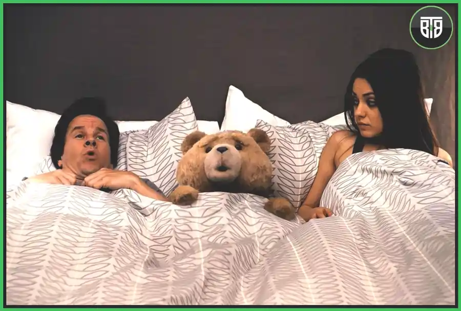 a teddy bear is sleeping between a couple in Ted (2012), best adult comedies