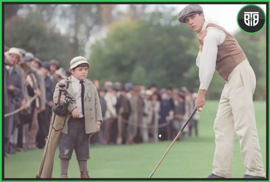 a man is playing golf and a boy is watching him in The Greatest Game Ever Played (2005), motivational movies in hindi