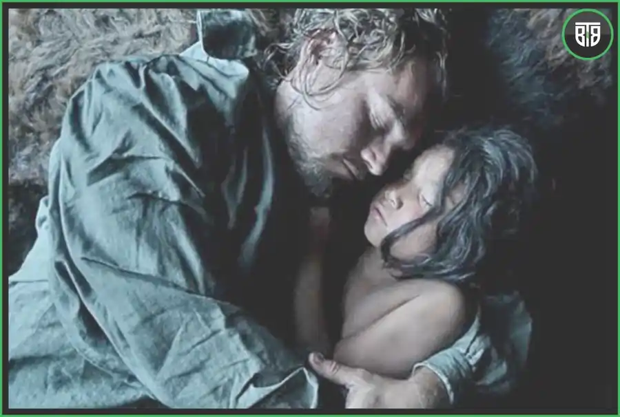a man and a small kid both are sleeping in cold in The Revenant - A 2015 Western/Drama Movie life changing movies hollywood