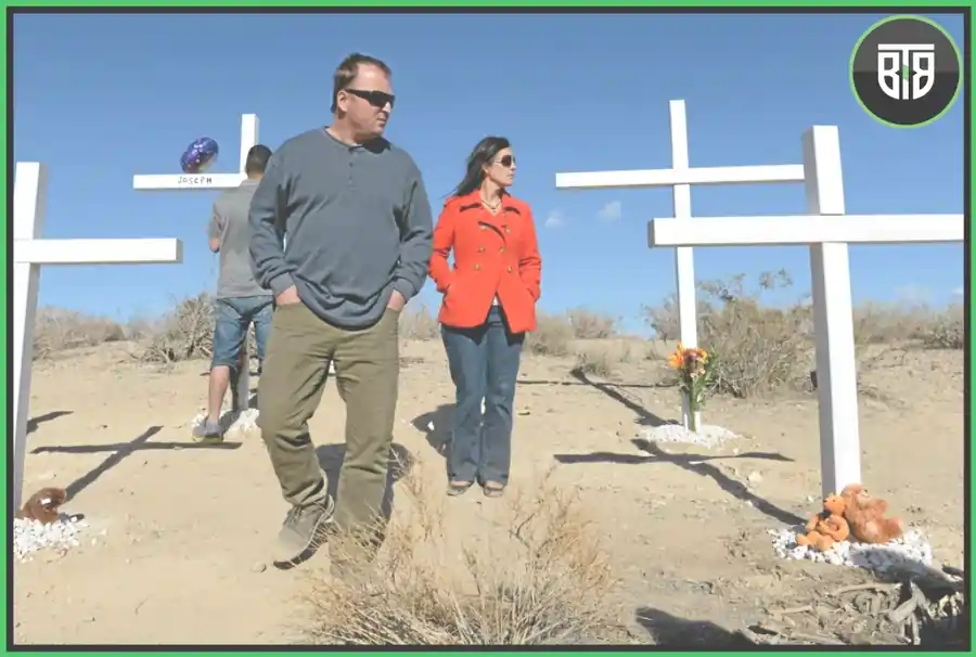 one man and a lady is roaming in a graveyard in Two Shallow Graves, discovery plus stream