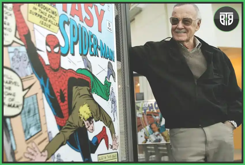 Stan Lee is standing with his famous comics like Spider Man, Iron Man, etc, stan marvel